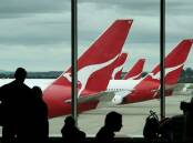Qantas planes outside a gate lounge. File picture