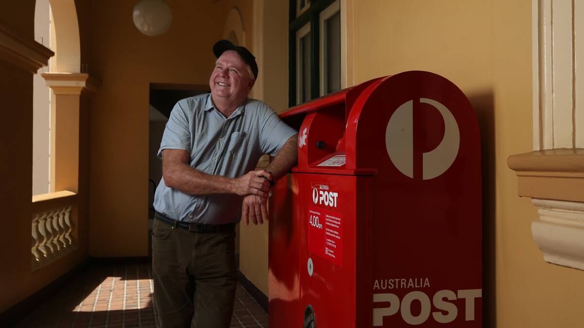 DETOUR: Neil Coutts at the Post Ofice mail box he used to send a letter to Maitland Hospital ... via Thailand. Picture: Simone De Peak.